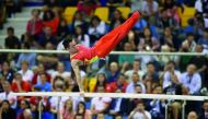 A gymnast in action at FIG Artistic Gymnastics World Cup Doha 2018.