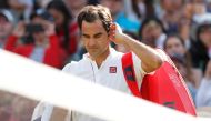 Switzerland's Roger Federer walks off court after loosing his quarter final match against South Africa's Kevin Anderson . Reuters/Andrew Boyers