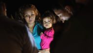 Central American asylum seekers, including a Honduran girl, 2, and her mother, near the US-Mexico border in McAllen, Texas on June 12, 2018. AFP / Getty Images North America / John Moore