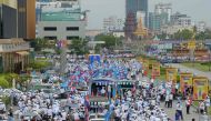 Supporters of Cambodian People's Party (CPP) parade in the street of Phnom Penh during the first day of campaign for the general election on July 7, 2018. AFP / TANG CHHIN Sothy