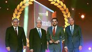 Omar Abdul Aziz Al Meer (second right), QIIB senior manager, Treasury and Investment Department,  with WUAB officials including Joseph Torbey(second left), chairman, Union of Arab Banks during the awards ceremony in Beirut. 