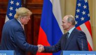 US President Donald Trump (L) and Russia's President Vladimir Putin shake hands before attending a joint press conference after a meeting at the Presidential Palace in Helsinki, on July 16, 2018.  AFP / Yuri Kadobnov 
 

