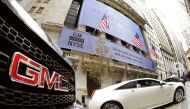 File photo shows GM cars outside the New York Stock Exchange in New York. (AFP / Timothy A. CLARY)