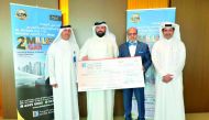 Dr Seetharaman (second right) CEO of Doha Bank with other officials and salary campaign winners. 