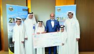 Dr R Seetharaman (second right) CEO of Doha Bank and others with ‘Al Dana Young Saver’ winner.
