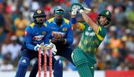 South Africa's Jean-Paul Duminy (R) hits a boundary next to Sri Lanka's wicketkeeper Niroshan Dickwella (L) and captain Angelo Mathews (C). REUTERS/Dinuka Liyanawatte