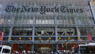 In this file photo taken on February 26, 2017 People take part in a protest outside the New York Times in New York.  AFP / Kena Betancur

