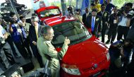 In this file photo Mahathir Mohamad gives a thumbs-up sign during the launch of the Proton Savvy, the national carmaker's new model in Kuala Lumpur on June 8, 2005. AFP / Tengku Bahar / File photo
