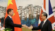 Britain's Foreign Secretary Jeremy Hunt (L) shakes hands with China's Foreign Minister Wang Yi after a joint news conference at the Diaoyutai State Guesthouse in Beijing, China July 30, 2018. REUTERS/Jason Lee