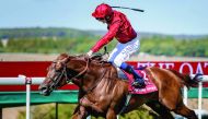 Lightning Spear reaching the finish line to win the Qatar Sussex Stakes at the Qatar Goodwood Festival in West Sussex, England yesterday. 