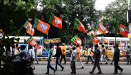 Bhartiya Janata Party (BJP) activists shout slogans in support of the publication of the first complete draft of the National Register of Citizens (NRC) and against what they say is illegal immigration of people from Bangladesh during a rally in Kolkata o