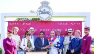Khalid Al Ali, Qatar Racing & Equestrian Club (QREC) Board Member presenting the winning trophy to a jockey during day four of the Qatar Goodwood festival in Goodwood, West Essex yesterday. 