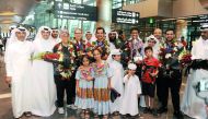 Qatar Bowling Federation officials and fans pose for a photograph with the victorious Qatar bowling team members upon their return from the USA at the Hamad International Airport in Doha yesterday.
Pictures: Abdul Basit / The Peninsula