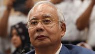 File photo of former Malaysian prime minister Najib Razak attending a press conference to announce his resignation as president of the United Malays National Organisation (UMNO), the main component party of the defeated Barisan Nasional (BN) coalition, in