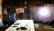 Tetsuo Yukioka (L), Managing Director of Tokyo Medical University and Keisuke Miyazawa, Vice-President of Tokyo Medical University, bow as they attend a news conference in Tokyo, Japan August 7, 2018. (REUTERS/Toru Hanai )