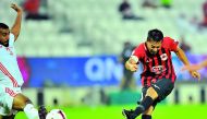 Al Rayyan skipper Rodrigo (right) shoots at goal during their QNB Stars League match against Umm Salal at the Al Sadd Stadium yesterday. RIGHT: Tabata and Umm Salal goalkeeper Baba Malick Ndiayd vie for the ball possession. Pictures by: Baher Amin / The P