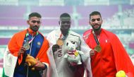 Gold medallist Abdalelah Haroun Hassan (centre) of Qatar, silver medallist Muhammed Anas Yahiya (left) of India and bronze medallist Ali Khamis of Bahrain pose with their medals after the 2018 Asian Games Men’s 400m final at the GBK Main Stadium in Jakart