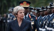 British Prime Minister Theresa May reviews a military guard of honour at the State House in Nairobi on August 30, 2018.   AFP / Yasuyoshi CHIBA
