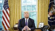 FILE PHOTO: US President Donald Trump listens during a phone conversation with Mexico's President Enrique Pena Nieto on trade in the Oval Office of the White House in Washington, DC.   AFP / MANDEL NGAN