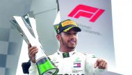 Mercedes' British driver Lewis Hamilton holds his trophy on the podium after winning the Italian Formula One Grand Prix at the Autodromo Nazionale circuit in Monza on September 2, 2018. AFP / Andrej Isakovic
