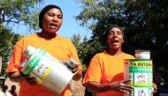 Women trained in using new storage technologies show off metal grain storage silos in Mnenia, Tanzania, June 7, 2018. Credit: Noor Khamis/University of Zurich