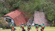 Rescue teams from Tokyo Police search for missing people in Astuma on September 9, 2018 after a 6.6-magnitude earthquake hit the northern Japanese island of Hokkaido on September 6. Japan OUT / AFP / JIJI PRESS / Jiji Press