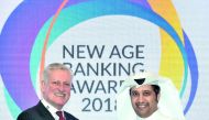 A QNB official (right) receiving the ‘Best Bank’ recognition, on behalf of the bank, at the New Age Banking Awards 2018 ceremony.