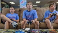 Aiden Keneally, Roman Wright and Benny O'Neill enjoy a game of Super Smash Brothers at a Game Gym camp in Potomac, Maryland, in late August. (Photo: Doug Kapustin / Washington Post)