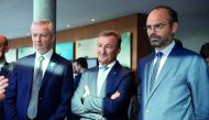 French Prime Minister Edouard Philippe (R) and French Economy Minister Bruno Le Maire (L) listen to general director of Dassault System Bernard Charles as they visit the group's headquarters prior to a press conference on the theme 