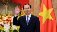In this file photo taken March 23, 2018, Vietnamese President Tran Dai Quang greets journalists as he waits for the arrival of Russian Foreign Minister Sergei Lavrov (not pictured) at the Presidential Palace. / AFP / POOL / MINH HOANG 