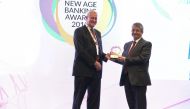 Mahmoud Malkawi (right), Ahlibank’s Acting CEO, receiving the award on behalf of the bank during the New Age Banking Summit 2018. 