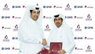 Qatar Chamber Director-General Saleh bin Hamad Al Sharqi (right) and QNB’s Assistant General Manager for Communication Salim Anzan Al Nuaimi shake hands after signing the sponsorship agreement, at the Qatar Chamber headquarters, yesterday.