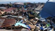 People search through debris in a residential area following an earthquake and tsunami in Palu, Central Sulawesi, Indonesia September 30, 2018 in this photo taken by Antara Foto. Antara Foto/Darwin Fatir/via REUTERS 