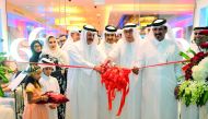 Sheikh Abdullah bin Ali bin Jabor Al Thani, (left) Chairman, Commercial Bank of Qatar; cutting a ribbon with Hussain Ibrahim Al Fardan, Vice-Chairman; and Mohamed bin Ahmed bin Towar  Al Kuwari (right) Vice-Chairman, Qatar Chamber; and other guests at the