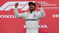 Mercedes' Lewis Hamilton celebrates winning the race on the podium REUTERS/Issei Kato