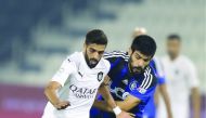 Al Sadd’s Hassan Al Haydos (left) vies for ball possession with an Al Sailiya player during their QNB Stars League match in Doha yesterday.