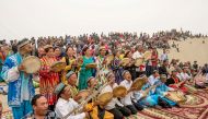 Folk artists play traditional music for tourists at Kashgar, Xinjiang Uighur Autonomous Region, China May 2, 2016. Reuters/Stringer