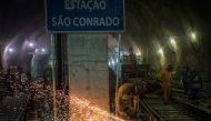 Workers are seen at the Sao Conrado metro station that will reach the Olympic Village in Rio de Janeiro, Brazil on April 13, 2016. AFP/Christophe Simon