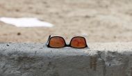 FILE PHOTO: A pair of sunglass with blood is seen at the site of a suicide bomb attack near a mosque in Kabul, March 9, 2018. Reuters/Omar Sobhani