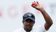 Sri Lanka's Rangana Herath shows the ball to celebrate taking six wickets after Sri Lanka won the test series. REUTERS/Dinuka Liyanawatte/File Photo