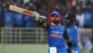 Indian cricket captain Virat Kohli raises his bat after scoring century (100 runs) during the second one day international (ODI) cricket match between India and West Indies at the Dr. Y.S. Rajasekhara Reddy ACA-VDCA Cricket Stadium in Visakhapatnam on Oct