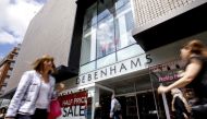 (FILES) In this file photo taken on June 19, 2018 Shoppers walk past a Debenhams shop in Oxford Street, central London. AFP / Tolga Akmen