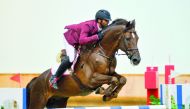 Mubarak Yousuf Al Rumaihi guides Vivaldi K over an obstacle during the Big Tour of the second round of the Hathab Tour at the Indoor Arena of Qatar Equestrian Federation (QEF) yesterday.