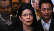 Thai politician Khunying Sudarat Keyuraphan (C), speaks to journalists after being named Puea Thai Party's strategy committee chairwoman in Bangkok on October 28, 2018. / AFP / Lillian SUWANRUMPHA 