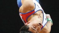 Artur Dalaloyan of Russia competes in the Men’s horizontal bar during the Men’s Team final of the 2018 FIG Artistic Gymnastics Championships at Aspire Dome in Doha on  Monday.