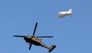 A NATO helicopter flies over the Resolute Support headquarters in Kabul, Afghanistan November 3, 2018.REUTERS/Mohammad Ismail
