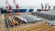 This photo taken on November 4, 2018 shows new buses lined up for export at a port in Lianyungang, east China's Jiangsu province. China OUT / AFP / STR