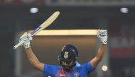 Indian cricket captain Rohit Sharma raises his bat after scoring a century (100 runs) during the second T20 cricket match between India and West Indies at the Bharat Ratna Atal Bihari Vajpayee Ekana Cricket Stadium in Lucknow on November 6, 2018. AFP / Mo