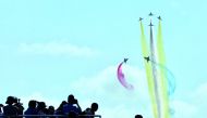 People watch J-10 fighter jets of Bayi aerobatic team of Chinese People's Liberation Army (PLA) Air Force perform at the China International Aviation and Aerospace Exhibition, or Zhuhai Airshow, in Zhuhai, Guangdong province, China November 6, 2018. China
