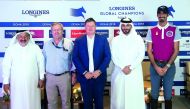 Marco Danese, Longines Global Champions Tour (LGCT) Sports Director, Jan Tops, Founder and President of the LGCT, Ali Al Rumaihi, Event Director and Qatari rider Sheikh Ali bin Khalid Al Thani pose for a photograph during a press conference held in Doha, 
